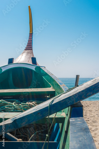 Arte Xavega typical portuguese old fishing boat on the beach in Paramos, Espinho, Portugal. photo