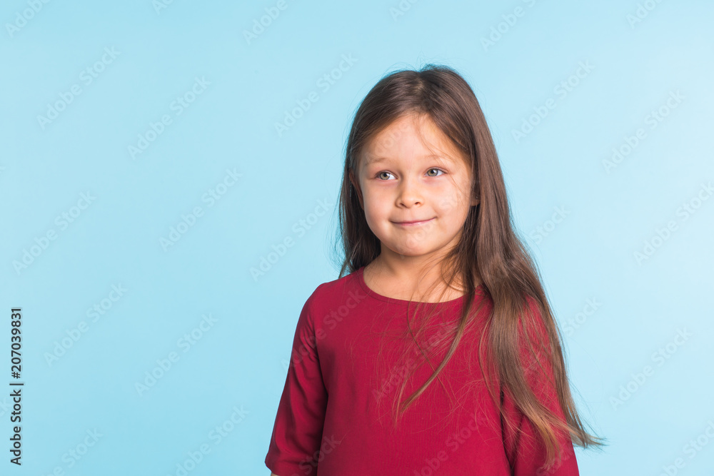 Sweet little girl over blue background with copyspace Sweet little girl over blue background with copyspace