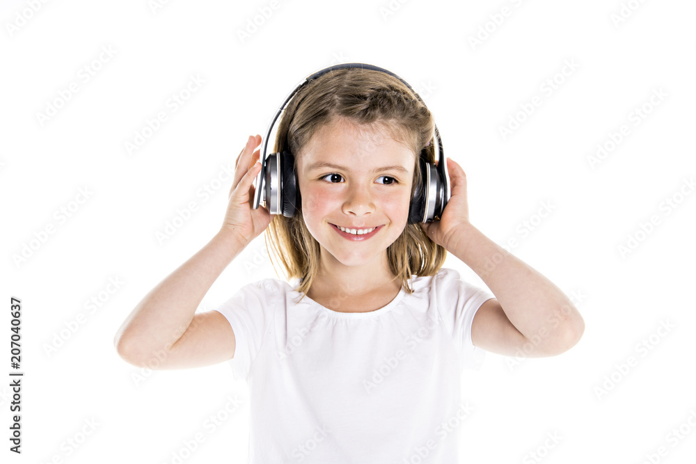 Portrait of a cute 7 years old girl Isolated over white background with headphone Portrait of a cute 7 years old girl Isolated over white background with headphone