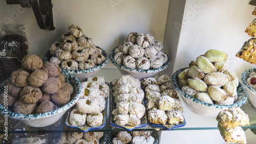 typical Sicilian sweets made of marzipan in the shape of fruits, vegetables, animals and more curious and fun shapes in a famous shop in the main street of Taormina, Sicily, Italy