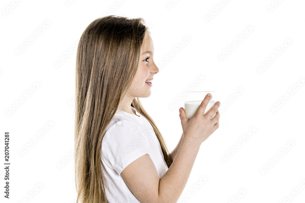 Portrait of a cute 7 years old girl Isolated over white background with milk glass