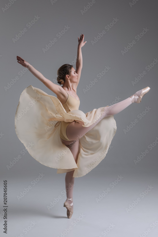Dancing is creating a sculpture! Beautiful graceful delicate young woman dancing and showing the beauty of a such classical art as ballet. Dancing is creating a sculpture! Beautiful graceful delicate young woman dancing and showing the beauty of a such classical art as ballet.