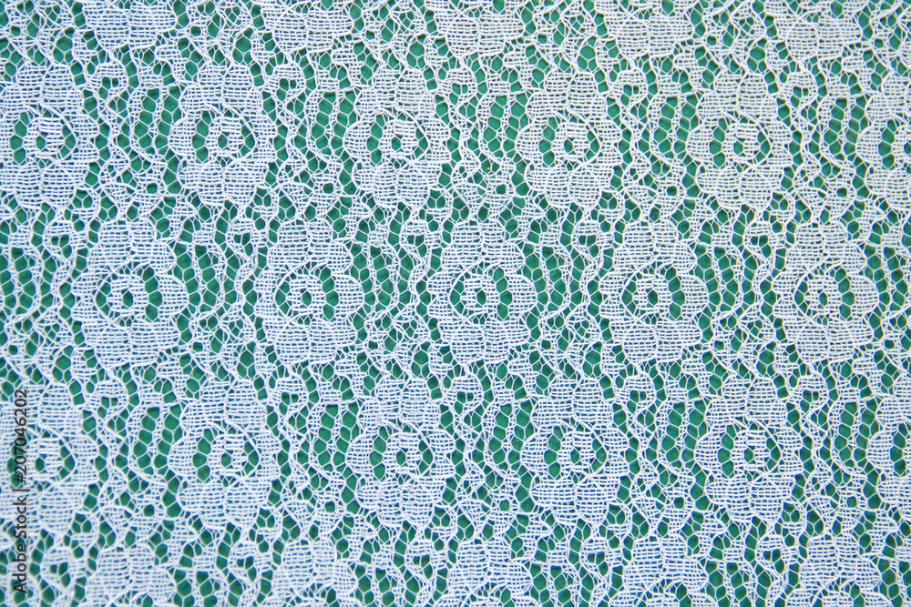 Openwork lace pattern on a green background Openwork lace pattern on a green background