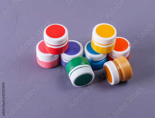 Colorful vibrant cans of gouache. Set for children's creativity