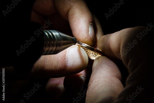 Jeweler makes a piece of jewelry