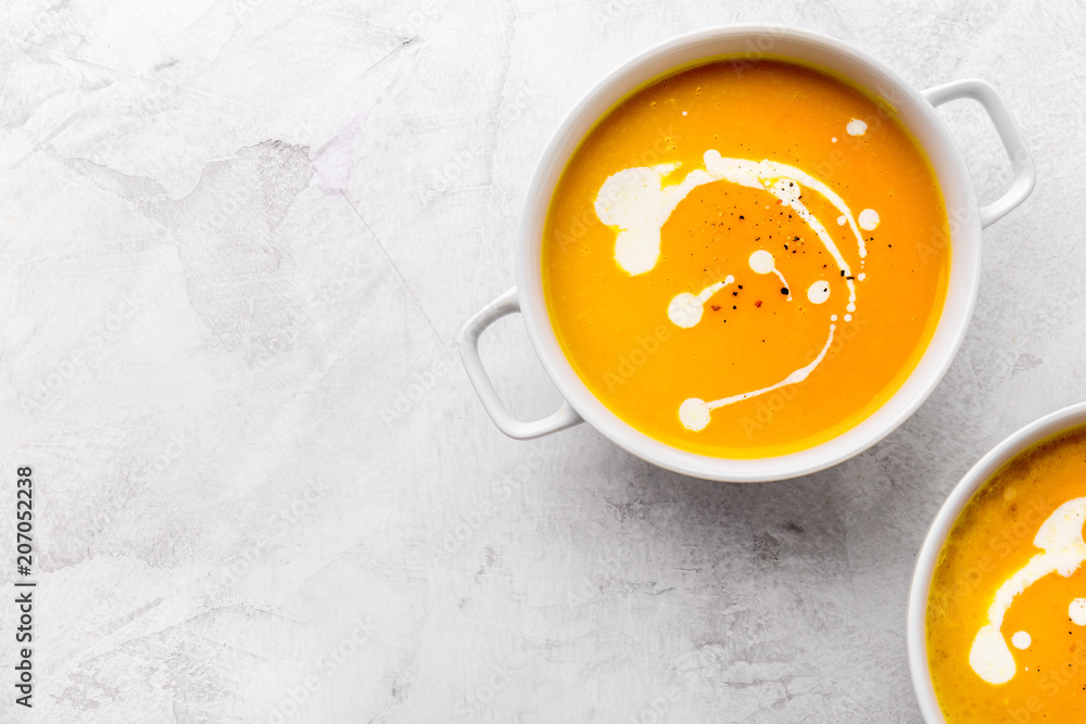 Pumpkin creamy soup decorated with fresh cream Pumpkin creamy soup decorated with fresh cream