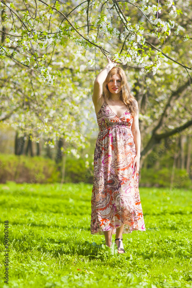 Youth Lifestyle Ideas. Portrait of Optimistic and Happy Caucasian Blond Female in Forest Having a Stroll. Youth Lifestyle Ideas. Portrait of Optimistic and Happy Caucasian Blond Female in Forest Having a Stroll.