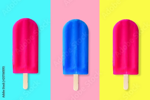Collage of pink and blue summer popsicles on bright blue, pink and yellow background