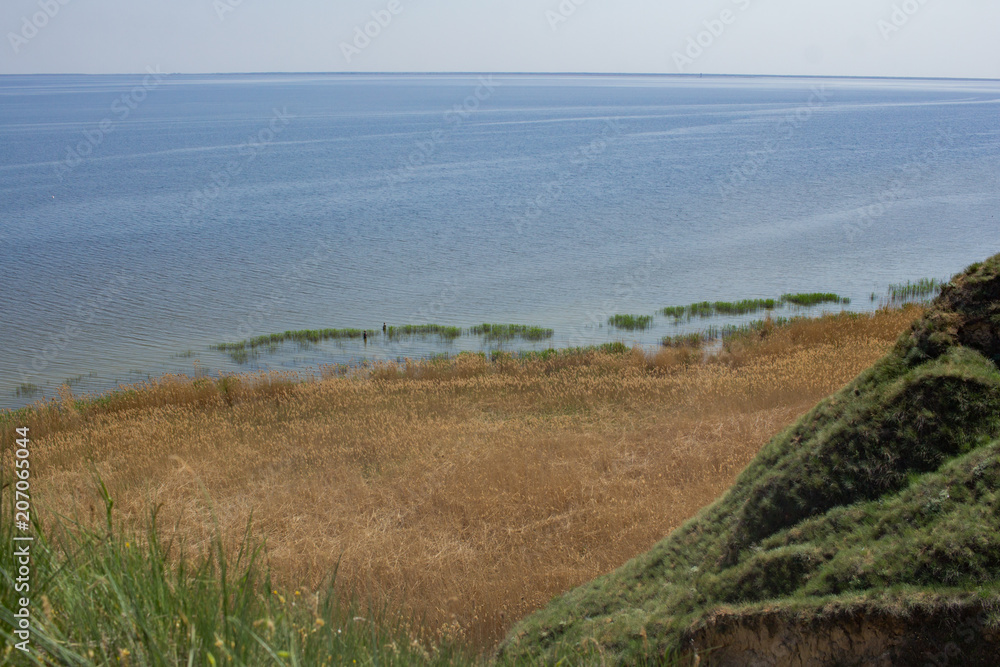 Beautiful summer landscapes with clay cliffs near delta of river Dnieper and Black sea	