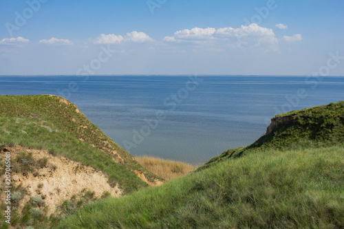 Beautiful summer landscapes with clay cliffs near delta of river Dnieper and Black sea