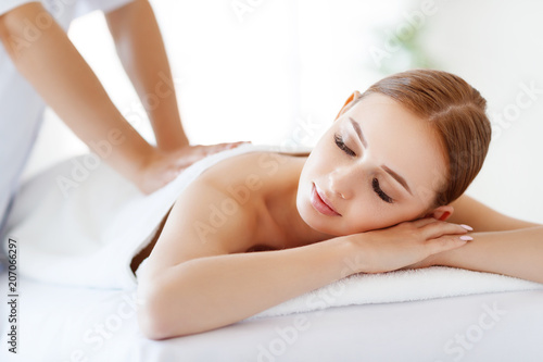 beautiful girl enjoys massage and spa treatments