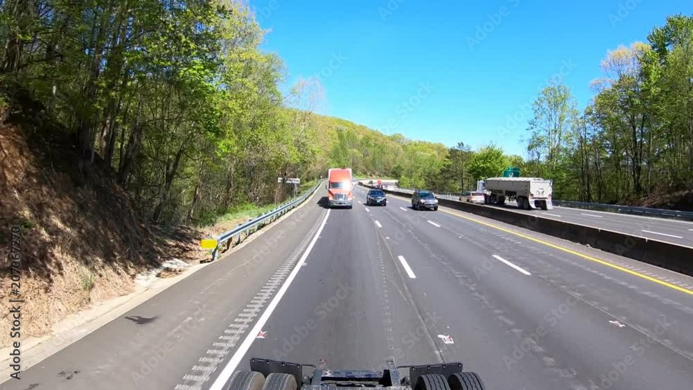 Semi transport truck rolling down the highway Semi transport truck rolling down the highway