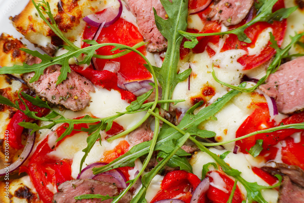 Pizza with veal and arugula texture, food background. Delicious italian cuisine, restaurant, food delivery, pizzeria, traditional recipe concept Pizza with veal and arugula texture, food background. Delicious italian cuisine, restaurant, food delivery, pizzeria, traditional recipe concept