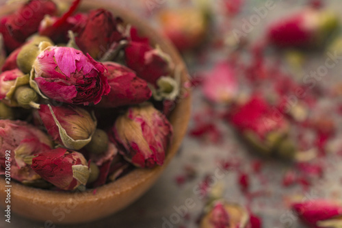 Dried Pink Rose Buds in a Brown Bowl