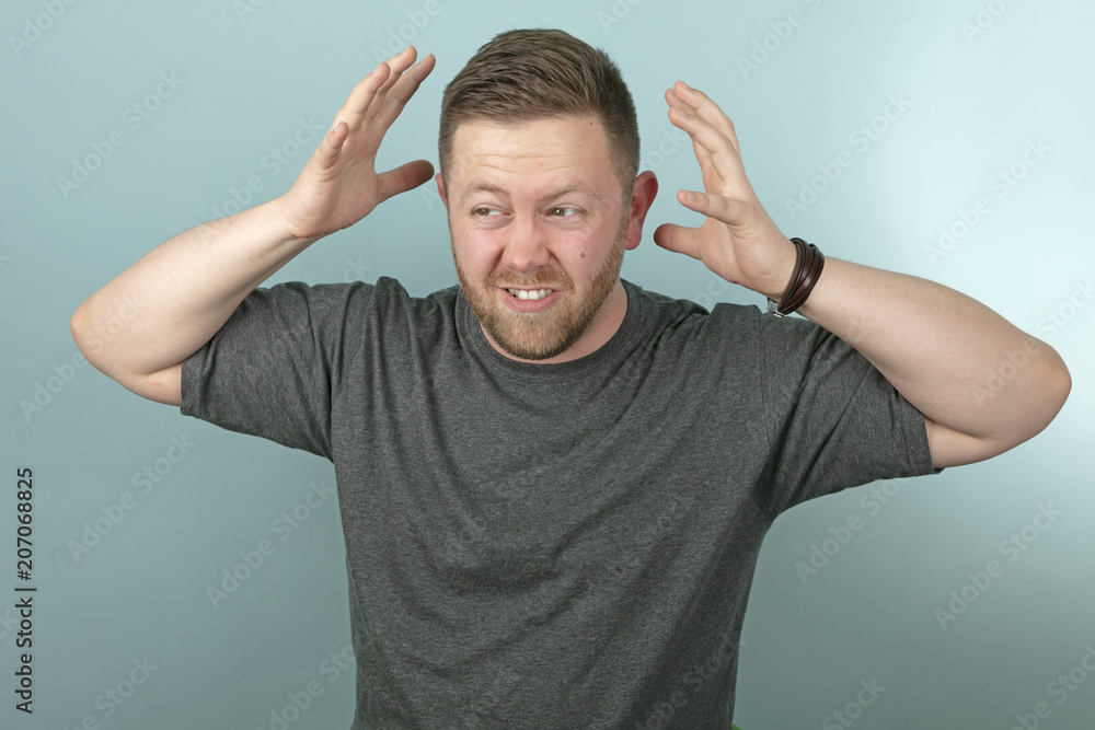 Frustrated angry man snarling and gesturing Frustrated angry man snarling and gesturing