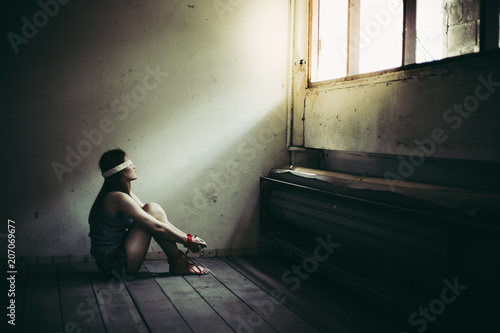Fotografie Asian woman feels hopeless and loneliness Beautiful woman is trafficking, kidnap or abduct by bad person