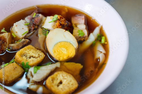 chinese roll noodles soup with pork and egg