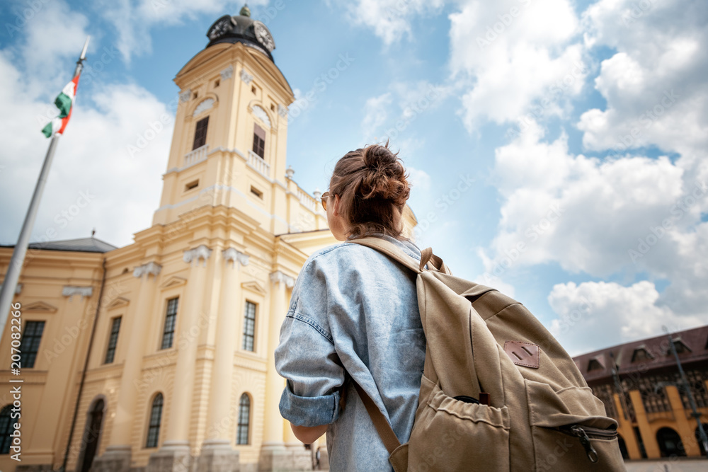 A young woman traveler visiting the sights in a summer trip across Europe, Hungary, Debrecen