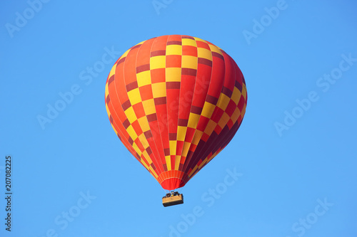 Colored balloon with people flying in the sky in Cappadocia