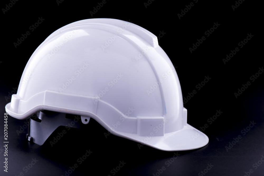 White Safety helmet on black background White Safety helmet on black background
