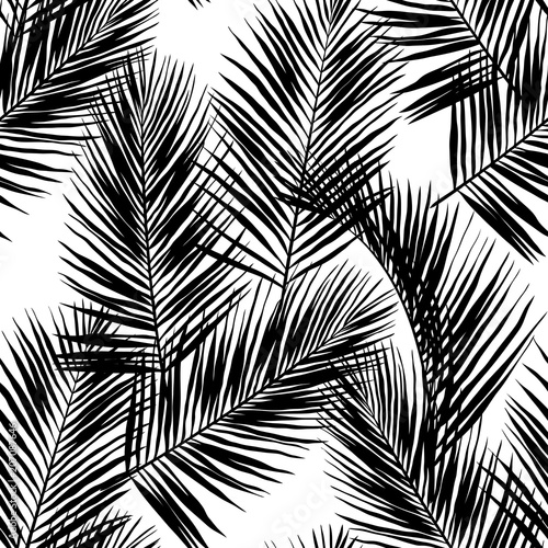 Black vector palm leaves isolated on white background. Hand drawn seamless pattern. Perfect for fabric, wallpaper or wrapping paper.