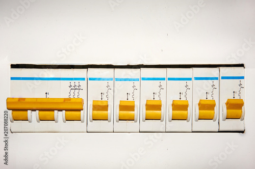 Group of automatic electrical switches on a white background.