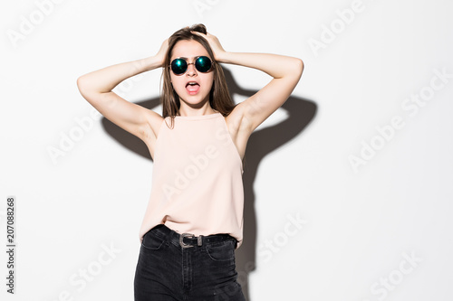Beauty Fashion brunette model girl in sunglasses Isolated on white. Fashion blogger © dianagrytsku