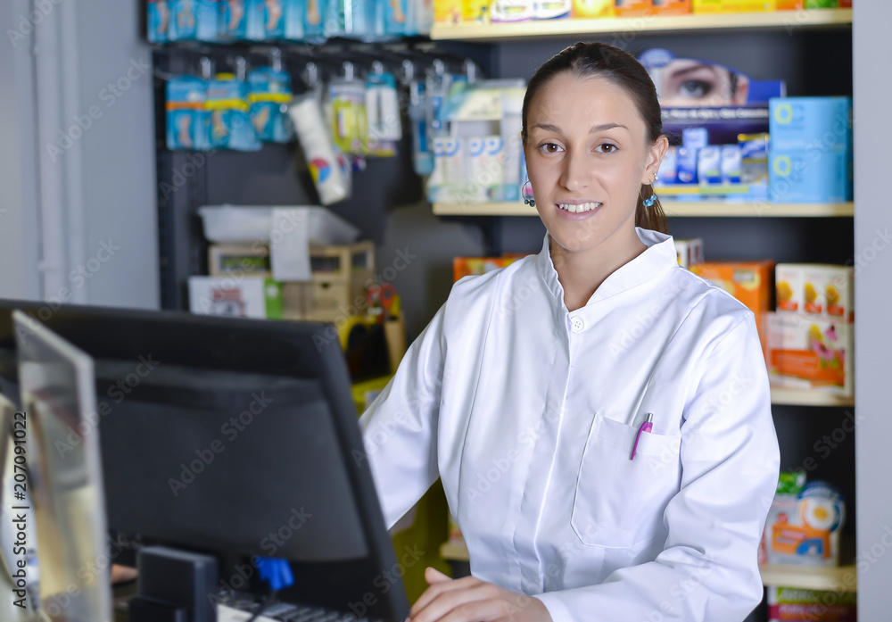 View of an attractive pharmacist at work