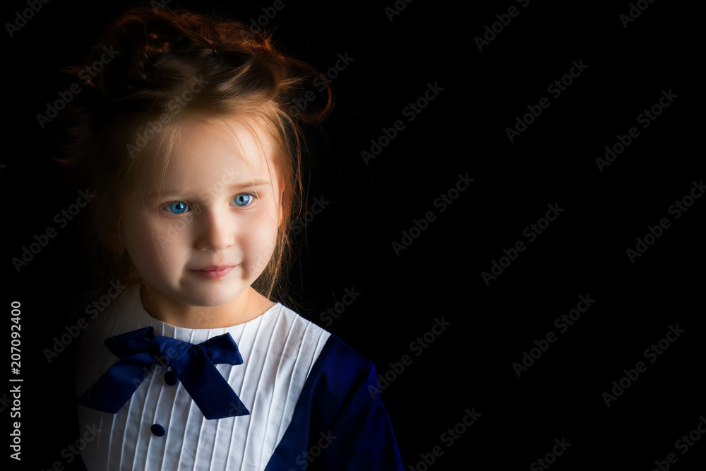 Little girl on a black background Little girl on a black background