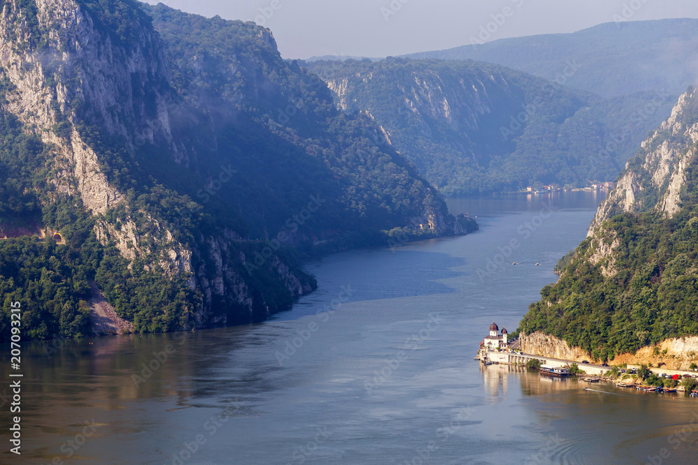 Summer landscape of Danube Gorge, at the border between Romania and Serbia. Mraconia orthodox monastery 