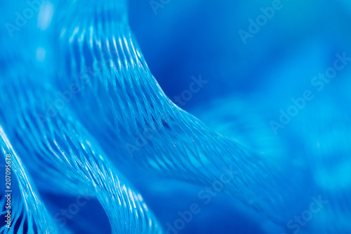 Blue synthetic sponge as an abstract background photo