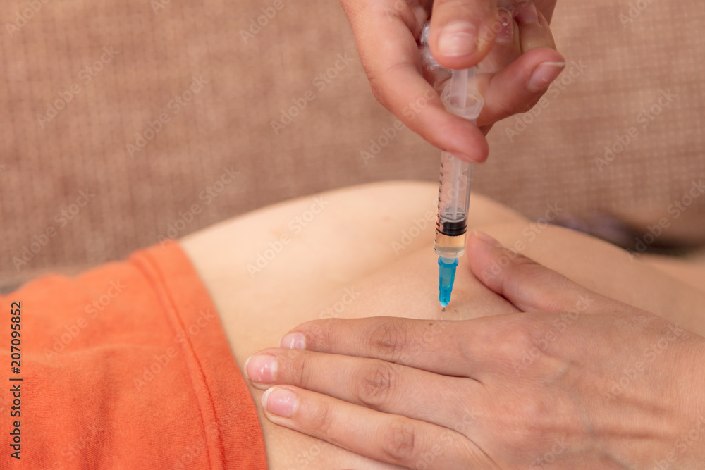 A shot from a syringe to a child A shot from a syringe to a child