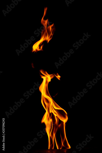 Red flame of fire on a black background