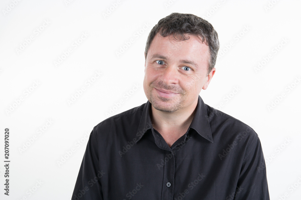 Young smiling man in black shirt on white background Young smiling man in black shirt on white background
