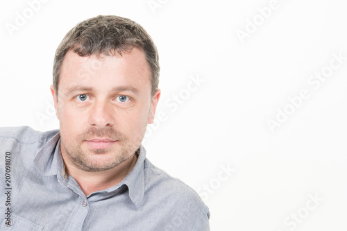 Confident handsome man with copy space on white background