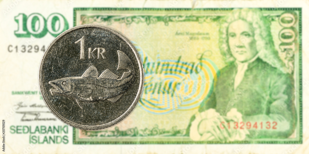 1 icelandic krona coin against 100 icelandic krona bank note 1 icelandic krona coin against 100 icelandic krona bank note