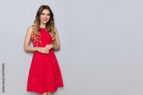 Smiling Elegant Young Woman In Red Dress