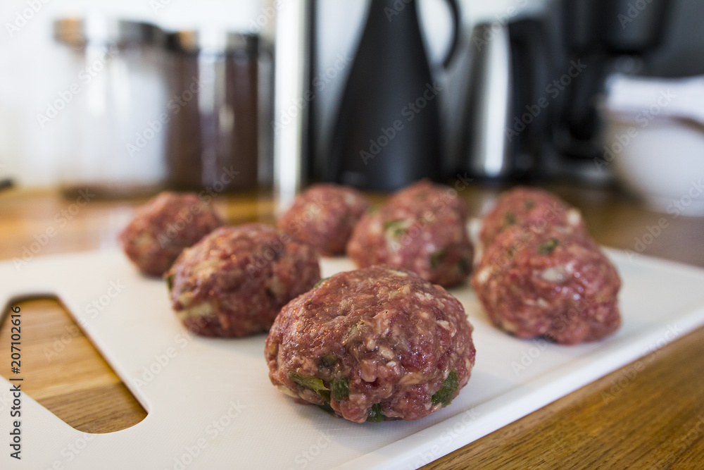 Making meatballs in a kitchen Making meatballs in a kitchen