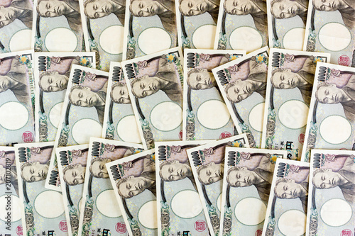 Money Yen Banknote, Business And Finance Concepts, Banknotes Stacked On Each Other In Different Positions photo