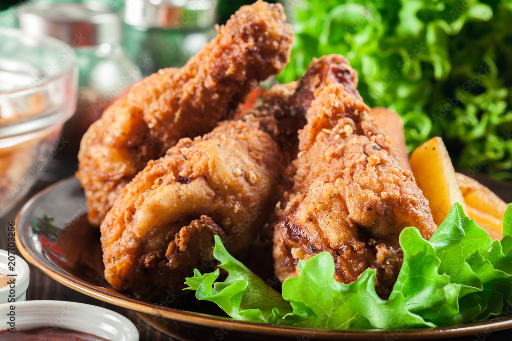 Crispy fried kentucky chicken legs with french fries Crispy fried kentucky chicken legs with french fries