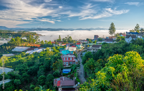 Landscape morning in small village in the valley on the plateau, distant fog shrouded the great hidden house on the outskirts of Dalat, Vietnam