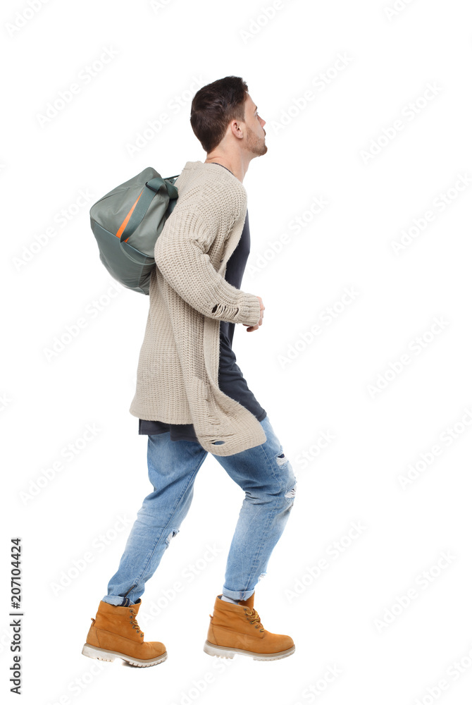 Naklejka premium Side view of a running man with a green bag.