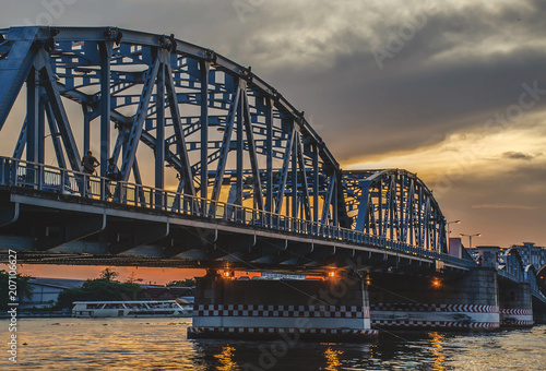 Krungthep - Rama III Bridge A bridge across the Chao Phraya River Between Ratchadapisek Road and Somdej Taksin Road in sunset ,Thon Buri in Bangkok Thailand. photo