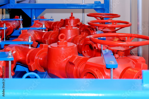 Industrial rotary valve and piping of red color.