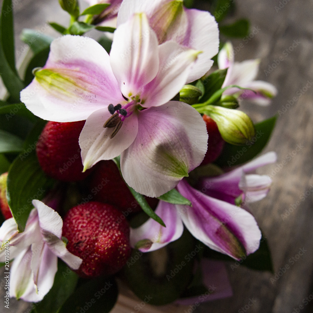 Obraz premium composition of bright ripe fruits and berries, flowers