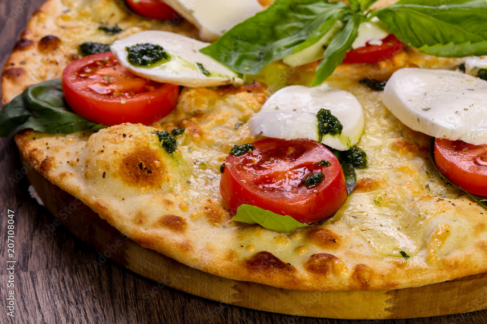 Pizza Caprese with basil