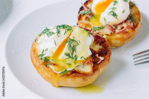 Eggs benedict  on a plate close up