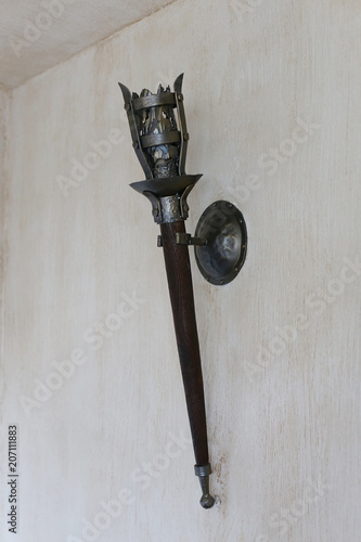 The lamp in the apartment, made as a mid-torch torch in the castle.