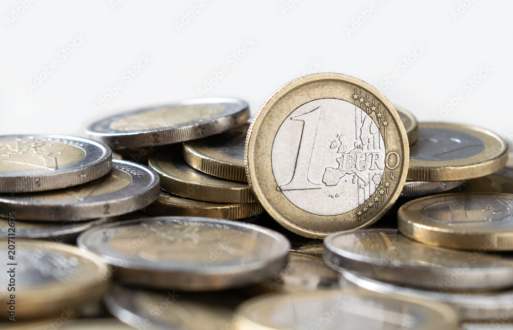 one euro coin located above of more coins one euro coin located above of more coins