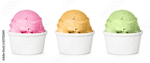 Different flavors of ice cream in the cup. Isolated on white background. Strawberry, peach and pistachio ice cream.